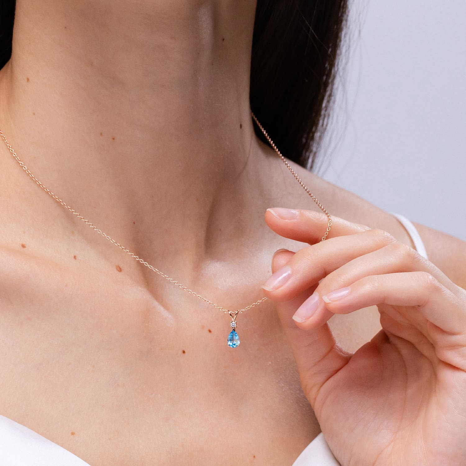 Prong-Set Swiss Blue Topaz Teardrop V-Bale Pendant with Diamond